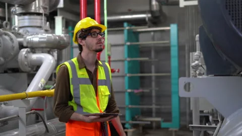 Industry Engineer manager using tablet computer checking information and safe Stock Footage 154283240