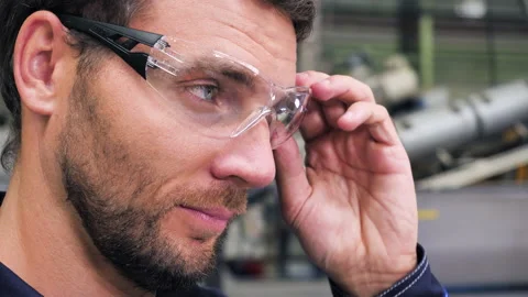 Industry Engineer Puts On Safety Glasses. Handsome Worker In Industrial Factory, Stock-Footage 146541843
