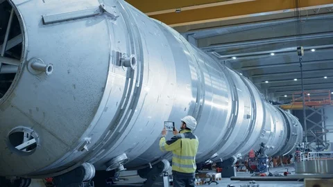 Industry Engineer Uses Augmented Reality Digital Tablet to Scan Large Diameter Stock Footage 114865184