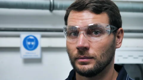 Industry Engineer Worker In Manufacturing Factory Puts On Safety Glasses. Stock-Footage 146541141