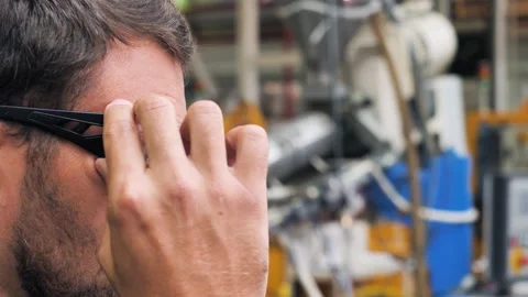 Industry Engineer Worker Puts On Safety Glasses. Handsome Workman In Factory, Stock Footage 146541682