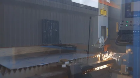 Industry machine cuts a sheet of metal with laser. Close up shot Stock Footage 122084329