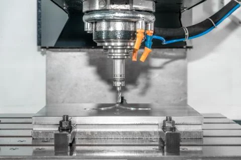 Industry machine precision part by CNC machine center working in factory. Stock Photos