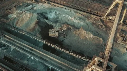 Industry manufacturing excavator loading a train aerial video 4K. Stock Footage 129688547