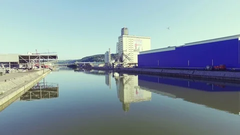 Industry river Shot with perfect reflection and typical buildings. Stock Footage 82453151