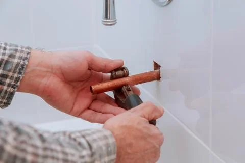 Industry system men worker cut joint with tool of copper pipe Stock Photos