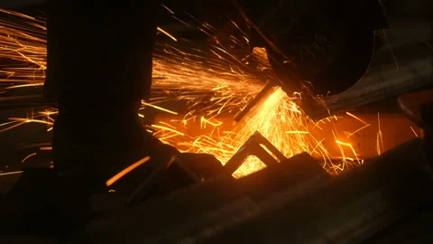 Industry worker cutting metal element construction with circular saw Stock Footage 130256344