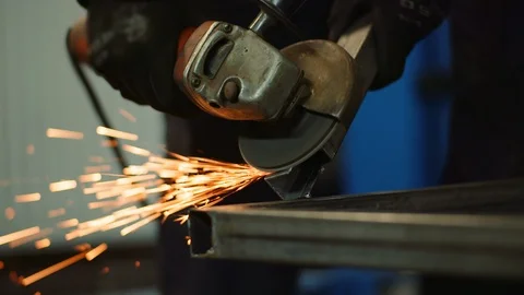 Industry Worker Grinding Metal with Angle Grinder Stock Footage 127146347