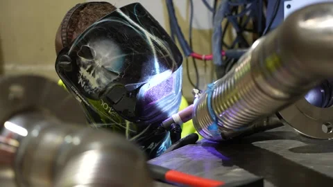 Industry worker welder welding a pipe Stock Footage 256143804