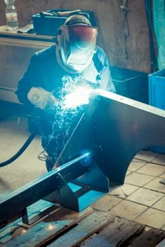 Industry worker is welding Stock Photos