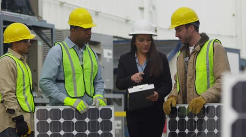 Industry workers plan solar panel installation Stock Footage 32739951