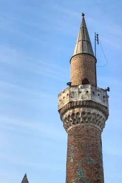 Ineffective interference for 500 years old masony mosque minaret in local pla Stock Photos