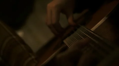 Inematic dark key, close up professional classical guitar playing Stock Footage 258296602