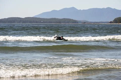 An inexperienced surfer learning how to surf Stock Photos