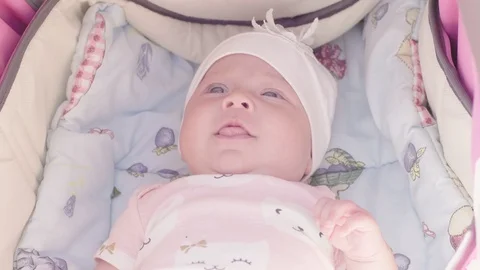 Infant baby lying  in stroller Vidéo 111973017