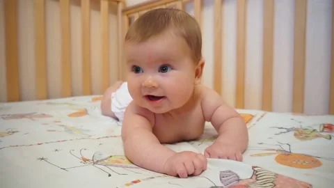 Infant in Bed Smiling, Playing, Cheerful Stock Footage 97764185