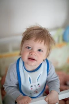 Infant in bed staying Foto stock