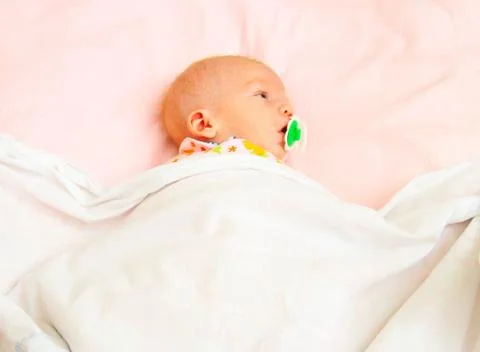 Infant in blanket Stock Photos