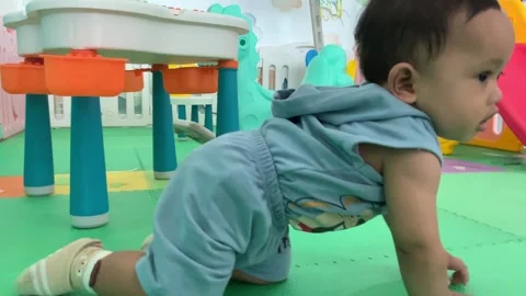 Infant boy playing in the playground Stock Footage 317762642