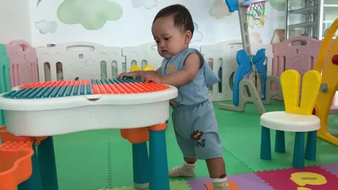 Infant boy playing in the playroom Stock Footage 317762614