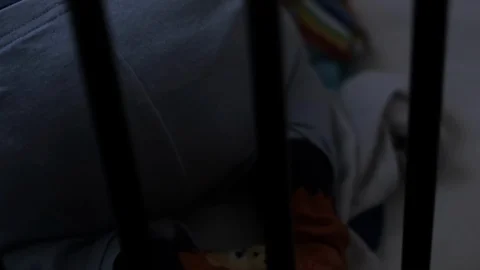 Infant child in his cot bed.  Stock Footage 102559811