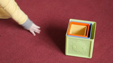 Infant child not interested in playing blocks. Stock Footage 99853623