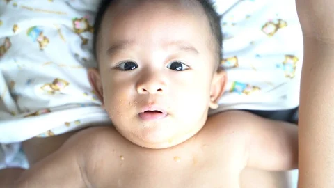 Infant Childboy lying for try eat food Stock Footage 108400994