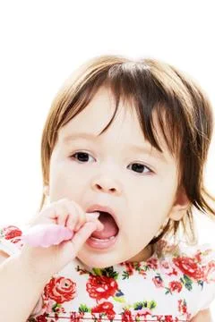 Infant cleans teeth Stock Photos