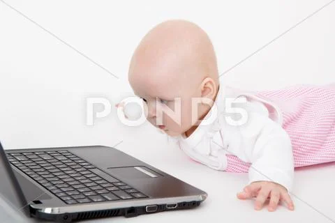 Infant with a computer Stock Photos