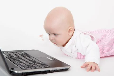 Infant with a computer Stock Photos