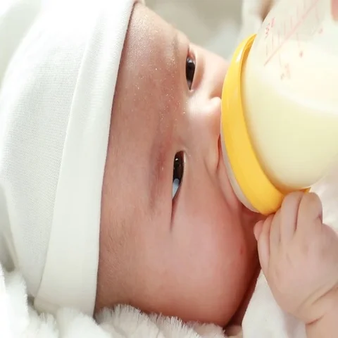 Infant drinking milk Stock Footage 69729830