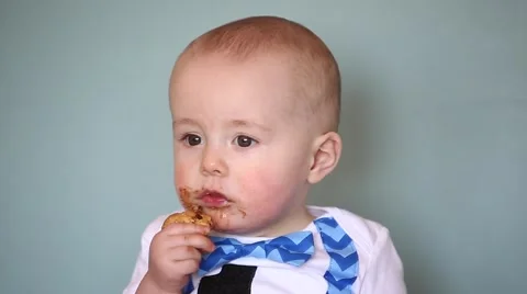 Infant eating a cookie Stock Footage 61955534