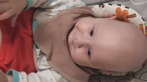 An infant eats baby formula from a bottle. Feeding a baby close-up.baby.Baby's h Stock Footage 163660143