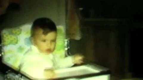 Infant in high chair Stock Footage 45817713