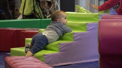 Infant at an indoor playground Stock Footage 71157284