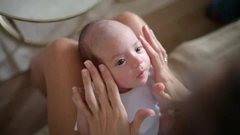 Infant on lap of mom Stock Footage 269350409