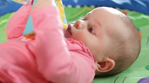 Infant on a play gym 3 Stock Footage 1075388