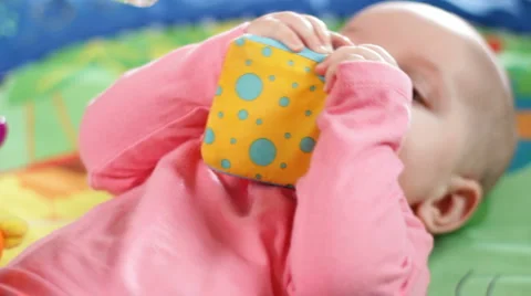 Infant on a play gym 4 Stock Footage 1075386
