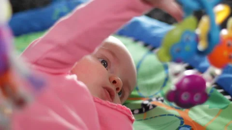 Infant on a play gym 7 Stock Footage 1073649
