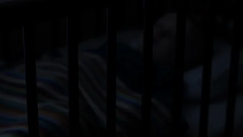Infant sleeping in his cot bed. Stock Footage 102565265