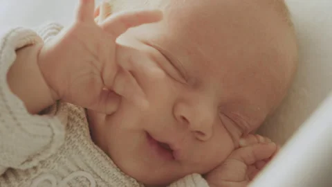 Infant waking up from his sleep Stock Footage 234331238