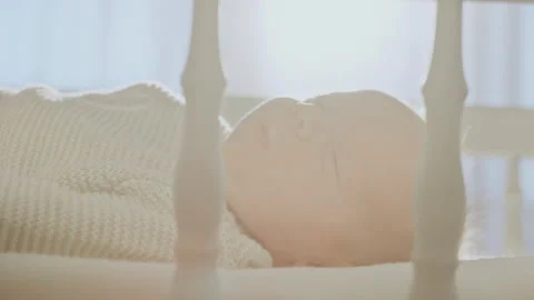 Infant waking up from sleep Stock Footage 234331688
