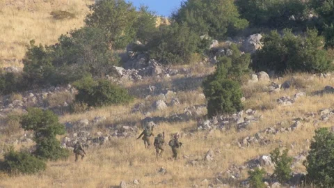 Infantry soldiers practicing with live rounds Stock Footage 137554929