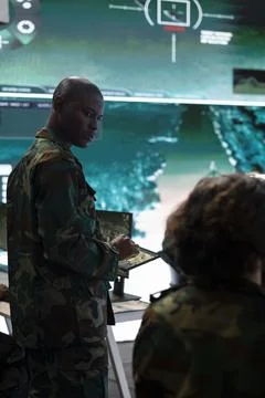 Infantry unit trooper studying the reconnaissance activity in control center Stock Photos