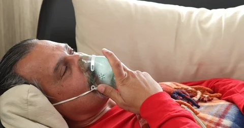 Infected Sick Man Is Breathing Through A Nebulizer Mask 8 스톡 동영상 126789178