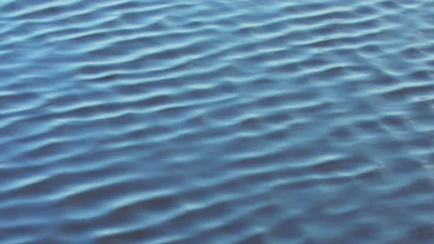 Infinite background of water waves in lake. Blue to black color. Natural texture Stock Footage 166710484