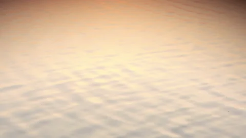 Infinite background of water waves move in lake with sunset reflection colors Stock Footage 149011473