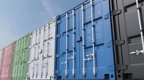 Infinite dolly shot of colored cargo containers against blue sky, shallow focus Video stock 68389394