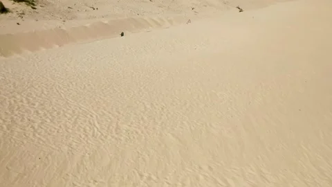 Infinite sand at dune of Valdevaqueros flight into desert road Stock Footage 167553675