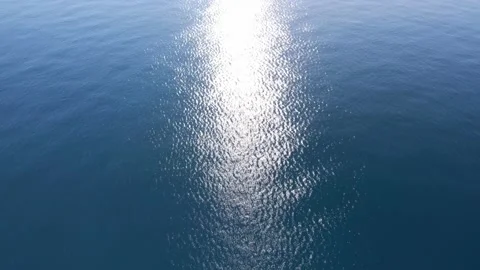 Infinite sea down view on morning sun reflection Stock Footage 167553285